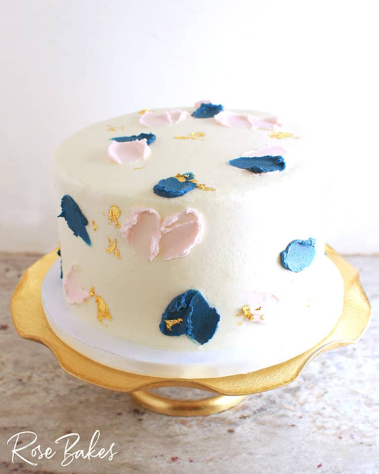 Modern Gender reveal cake with gold leaf details 