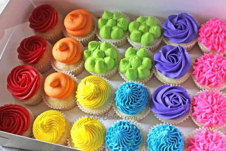 Boxed Rainbow Cupcakes with multiple colors of frosting