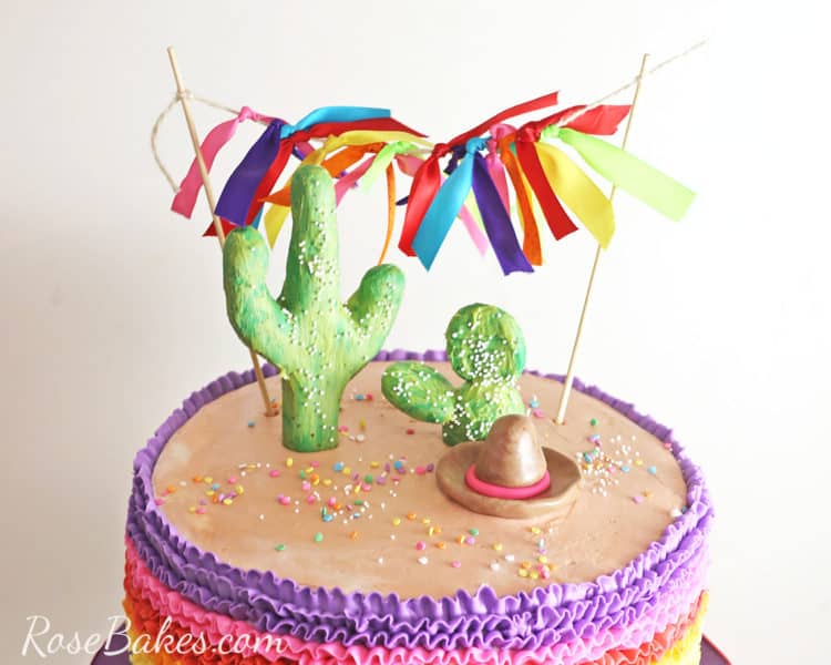 cactus cake topper and ribbon bunting on fiesta cake