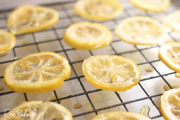 cooked candied lemon slices cooling on a cooling wack