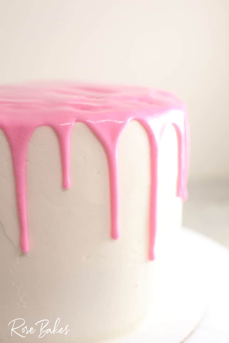 finished canned frosting drip cake - white cake with pink drip