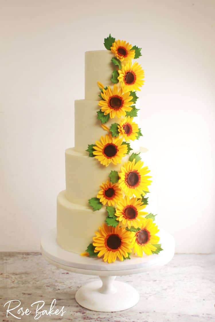 4 tier wedding cake with cascading sunflowers 