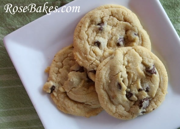 3 Chocolate Chip Cookies displayed on a white plate. 