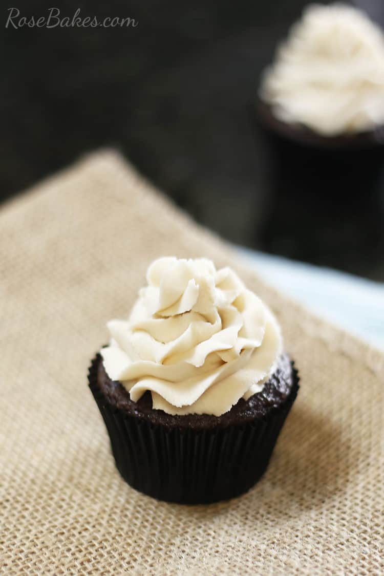 Chocolate cupcake with brown sugar buttercream piped on top.