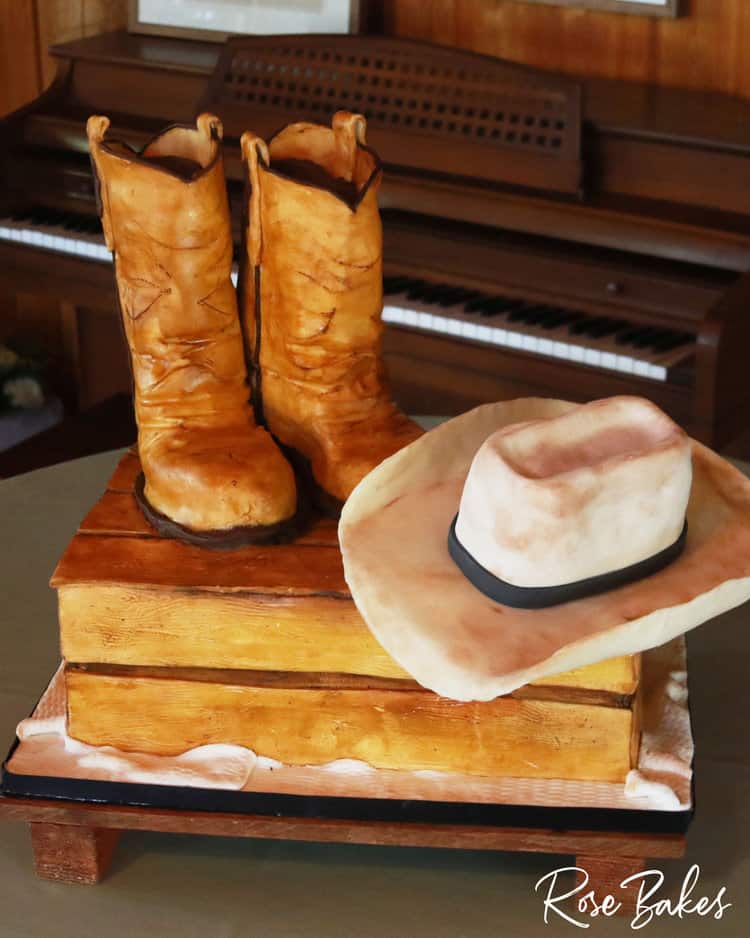cowboy groom's cake with edible crate, boots and cowboy hat 