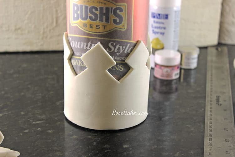 gum paste crown wrapped around can of beans to shape