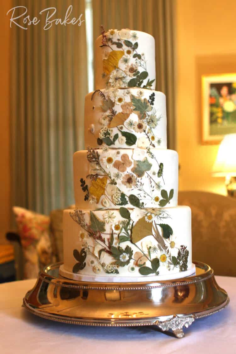 Pressed Flowers Wedding Cake on a silver stand