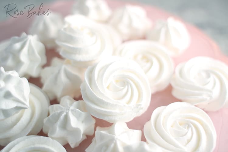 Meringues on a pink cake plate