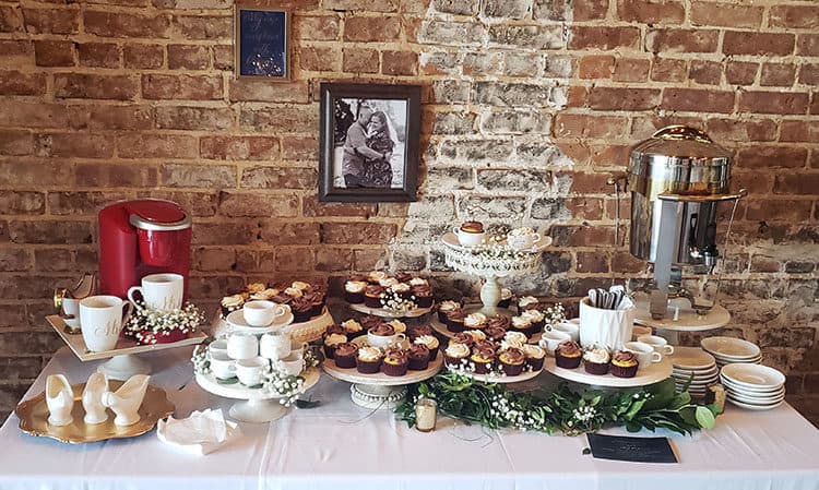 Groom's Table with a coffee theme. Cucpakes on cake stands with coffee maker