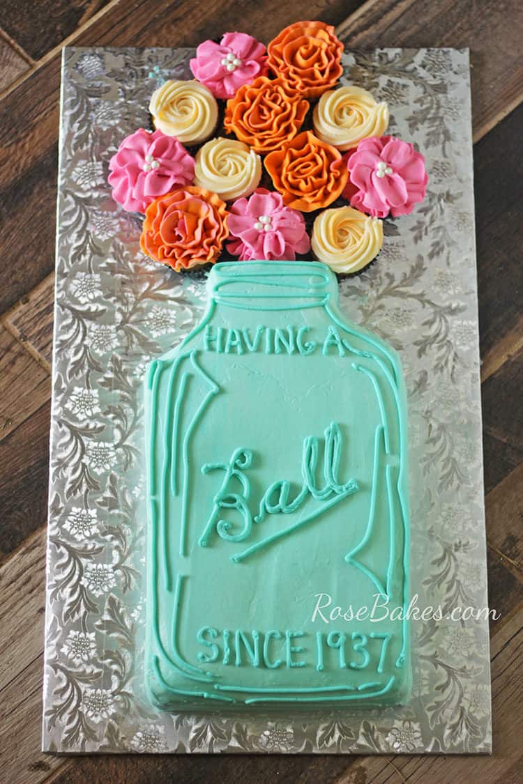 "Having a Ball" Mason Jar Cake with Flowers on silver cake board