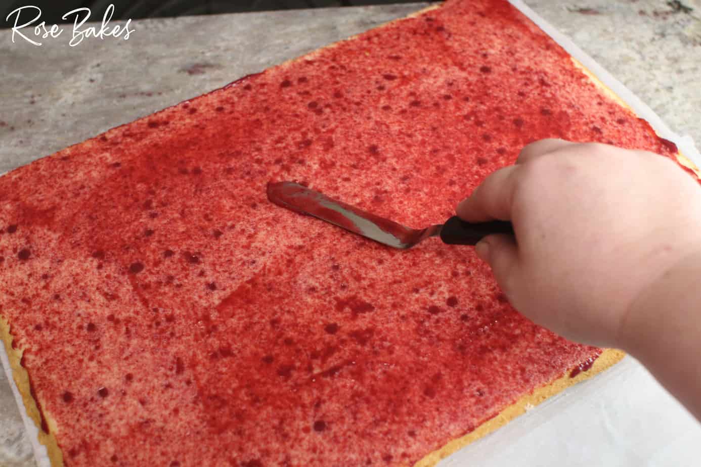 raspberry filling covering the cake layer