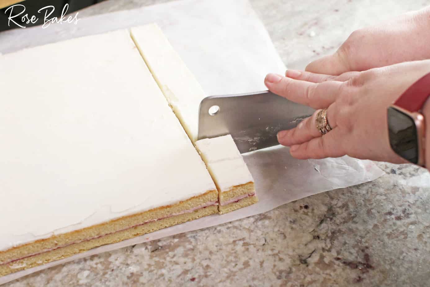 Slicing the cake into squares.