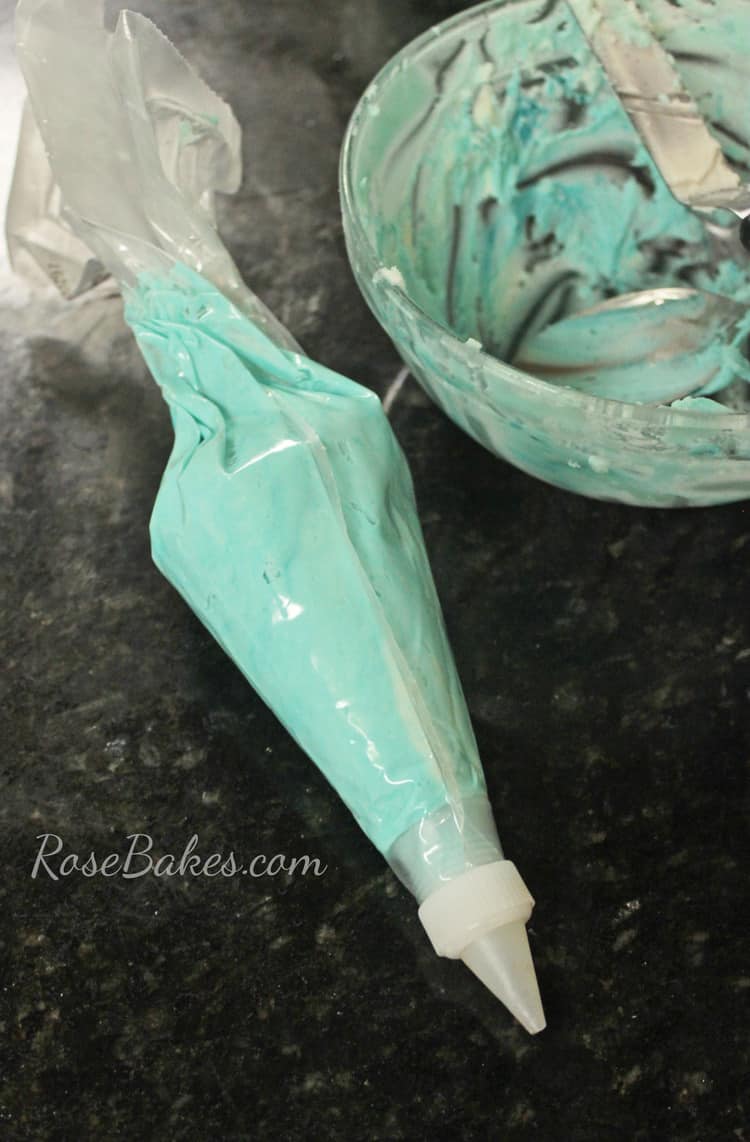 piping bag with tip and full of green icing 