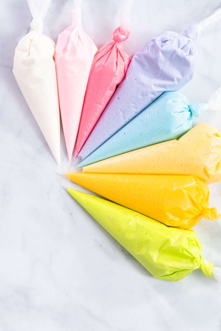 piping bags full of pastel icing