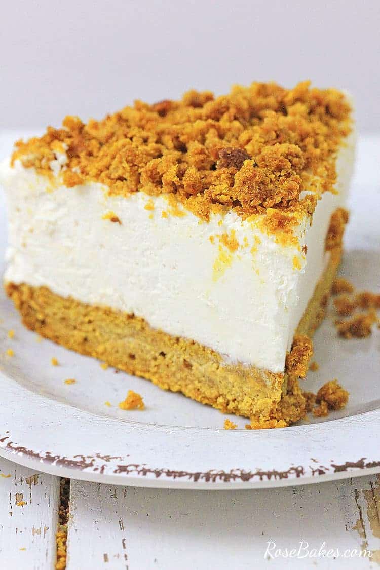 pumpkin bread bottom cheesecake slice on a white plate