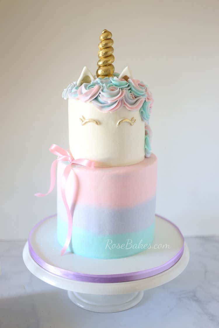 Unicorn cake with ribbon and gum paste unicorn horn and ears