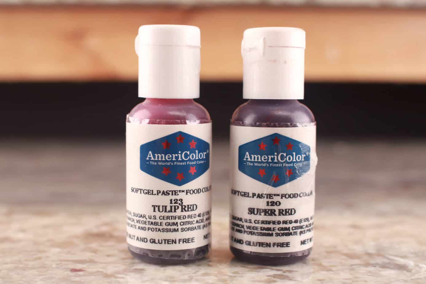 americolor tulip red and americolor super red gel colors. bottles on counter