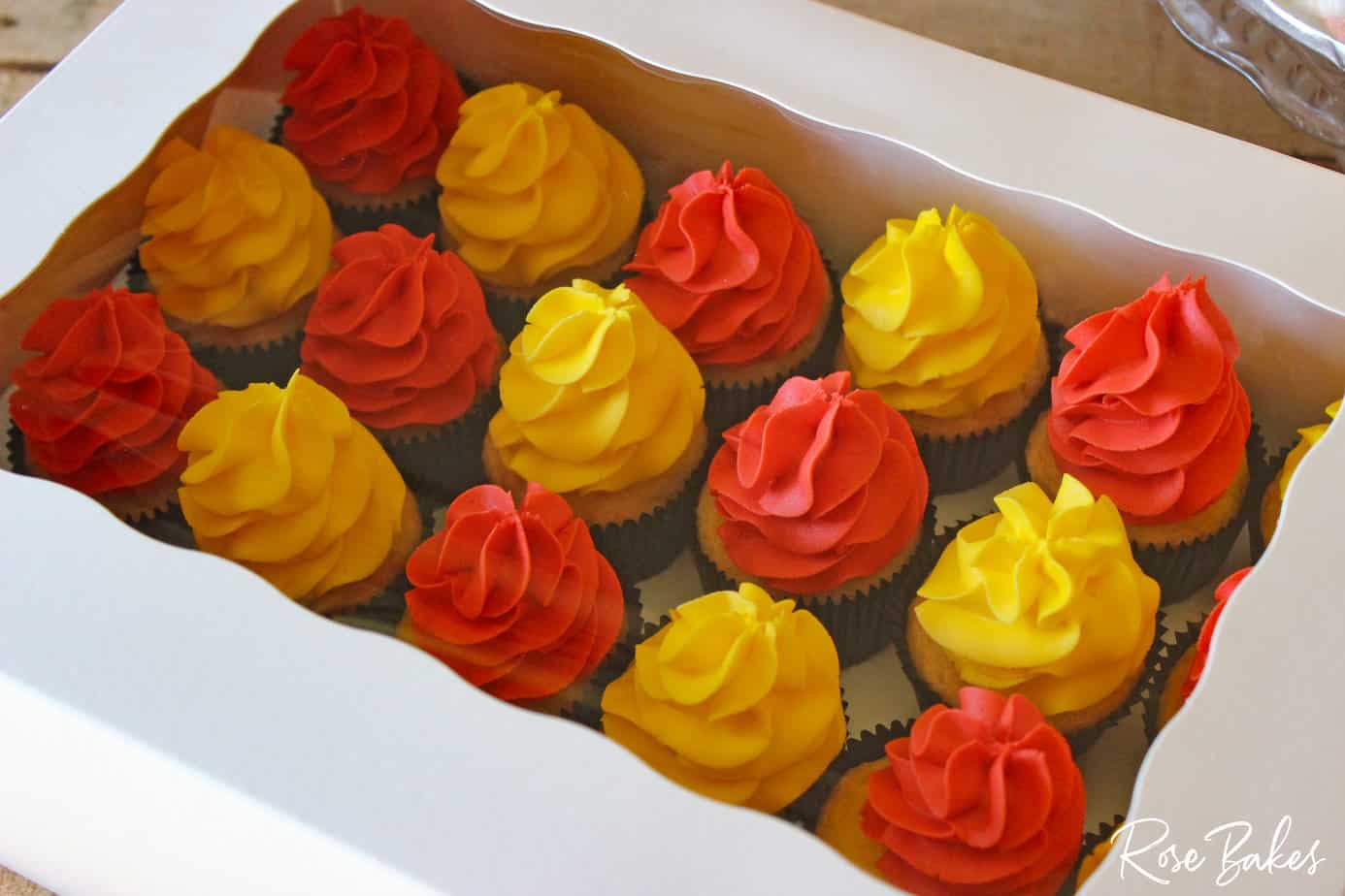 cupcakes with yellow and red frosting