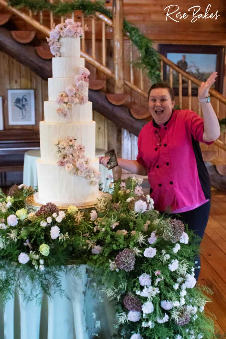 Rose excited standing next to Vertical Lines Wedding Cake