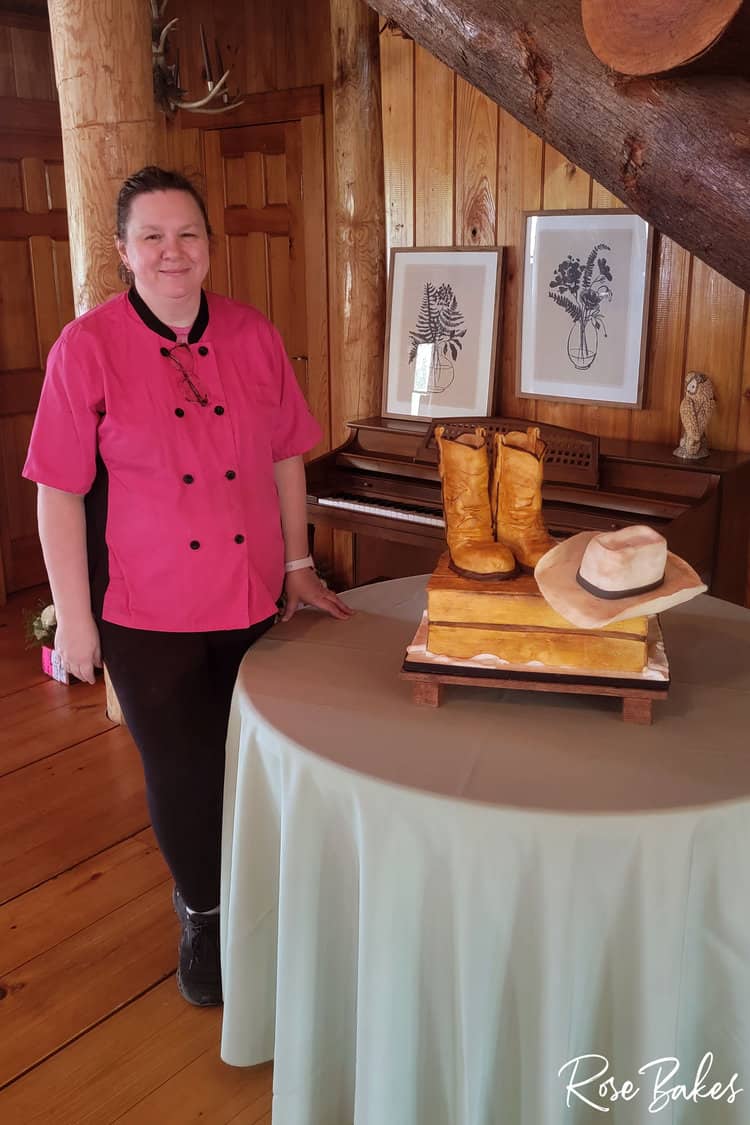 rose standing next to a cowboy groom's cake