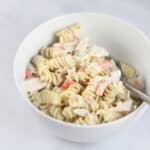 Crab pasta salad in a white bowl