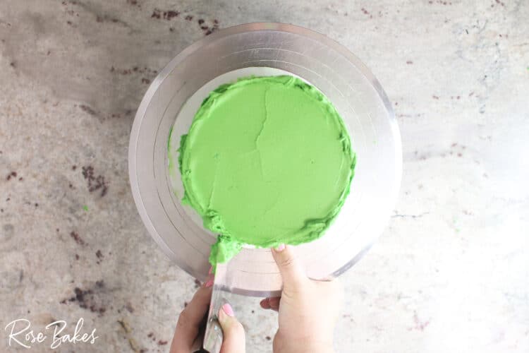 bench scraper smoothing green icing 