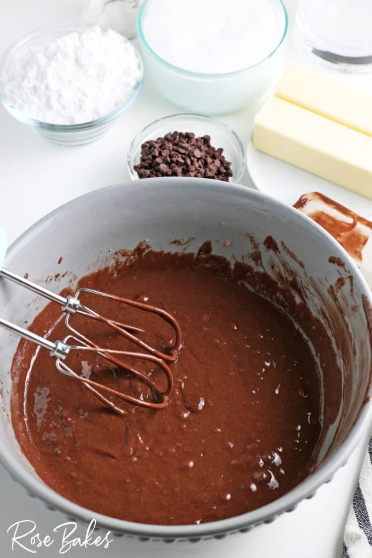 chocolate cake batter in mixing bowl with mixer for s'mores cupcakes