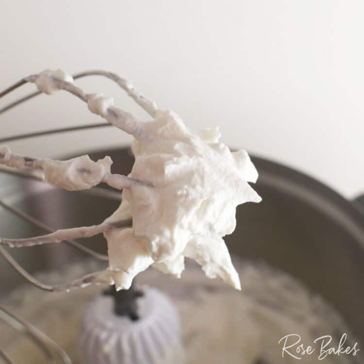 Whipped Cream on the end of a whisk attachment of a Bosch Mixer.