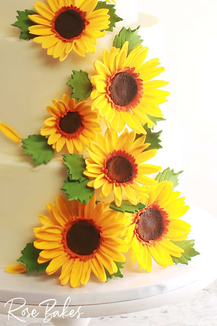 up close view of sunflowers used on wedding cake 