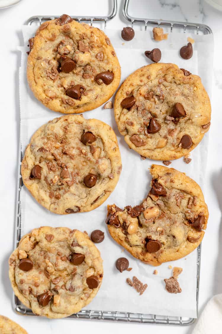 Toffee chocolate chip cookies on a cooling rack