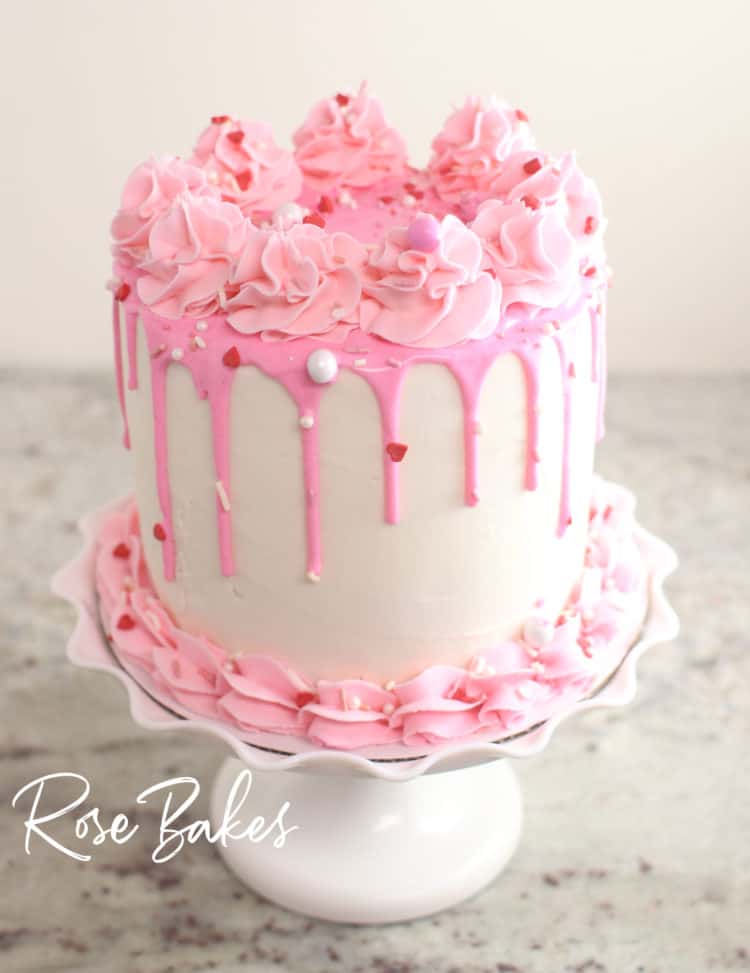 finished canned frosting drip cake - white cake with pink drip, pink buttercream and valentine's sprinkles