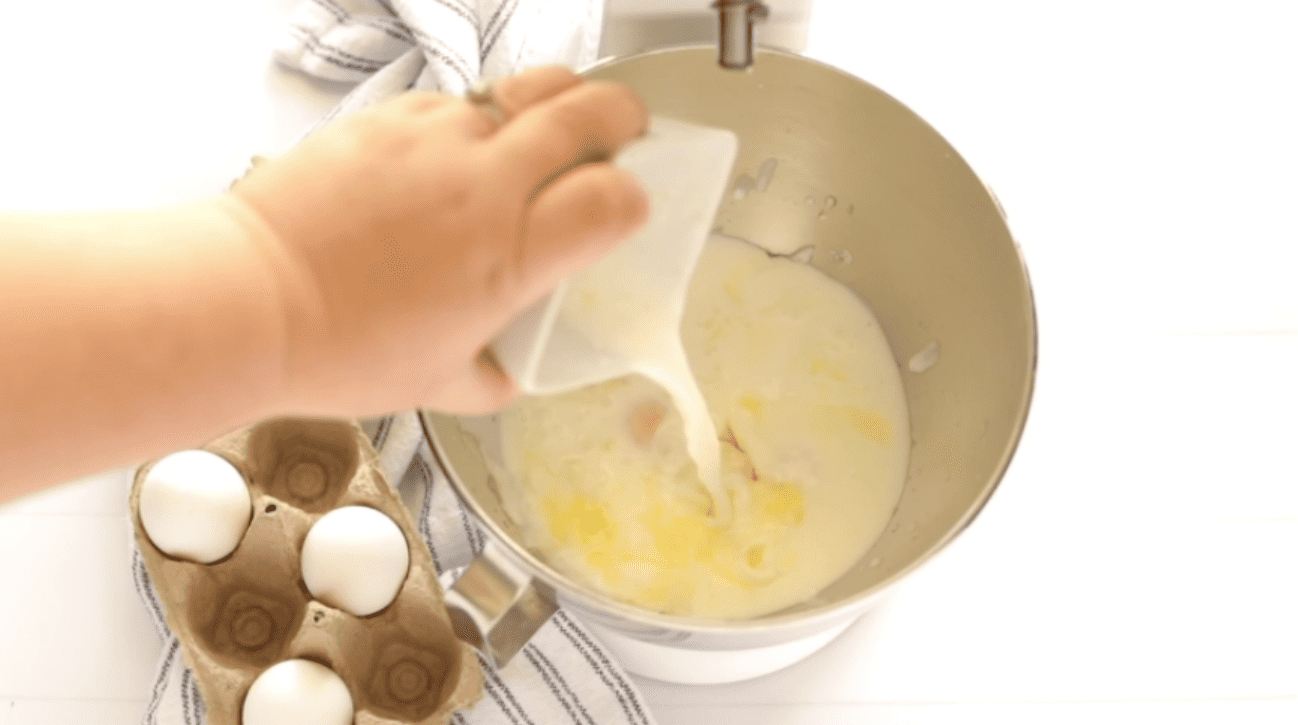 adding buttermilk to the melted butter and whipping cream to a mixing bowl