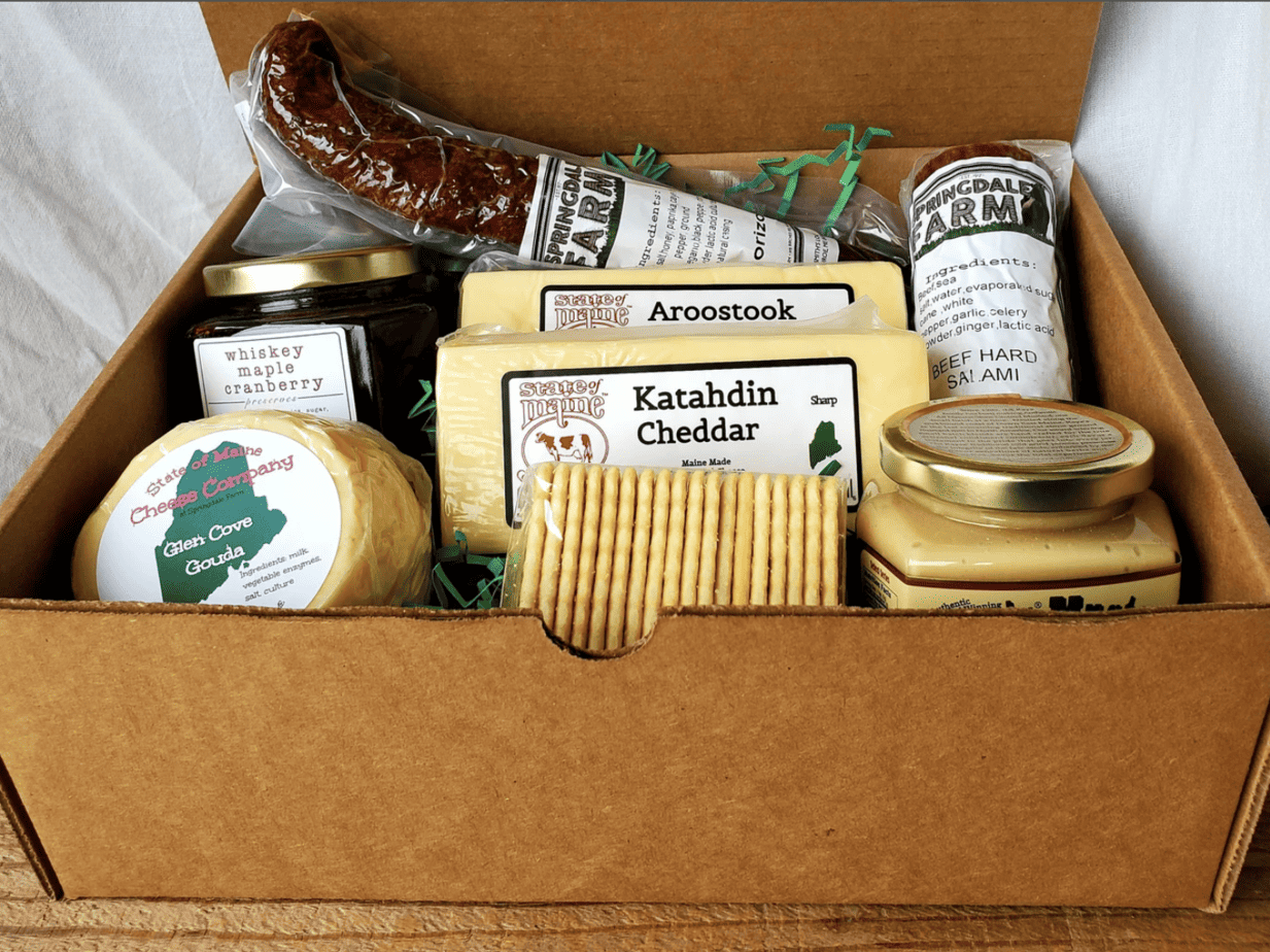 box of meats, cheeses, crackers for a charcuterie board gift
